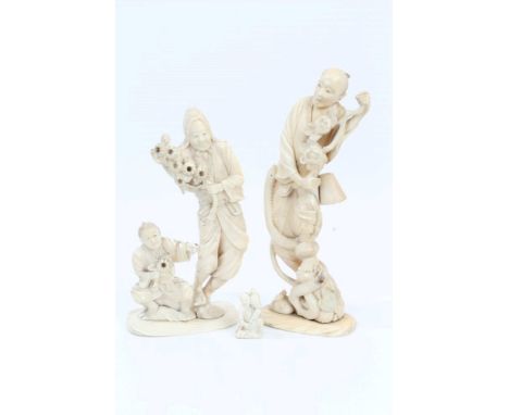 Three late 19th / early 20th century Japanese ivory okimonos - the first depicting a man being attacked by a snake, the secon