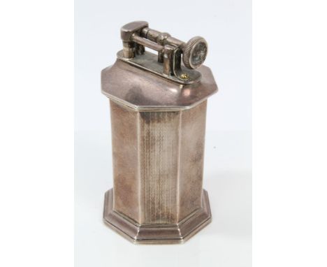 Late 1920s silver table lighter of octagonal form, with engine-turned decoration and top-mounted lighter mechanism, underside