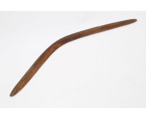 19th century Australian Aboriginal carved boomerang, 76cm long.Provenance: Offered together with an old handwritten label:  '