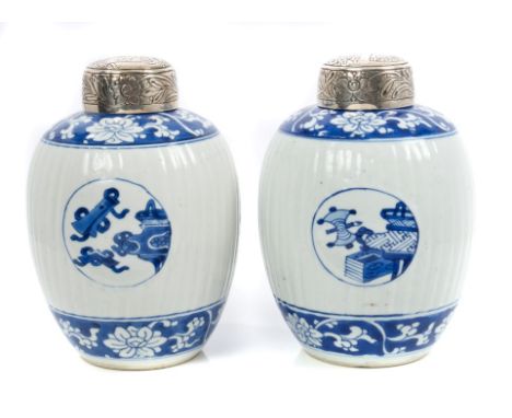 Pair late 17th century Chinese blue and white ovoid jars painted with roundels of precious objects, on a fluted ground within