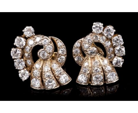 Pair Art Deco diamond earrings, the stylised scroll set with old cut diamonds.  Estimated total diamond weight approximately 