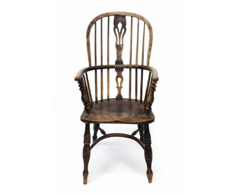 Early 19th century ash and elm stick back Windsor chair, the arched back with pierced splat, having solid saddle seat on turn