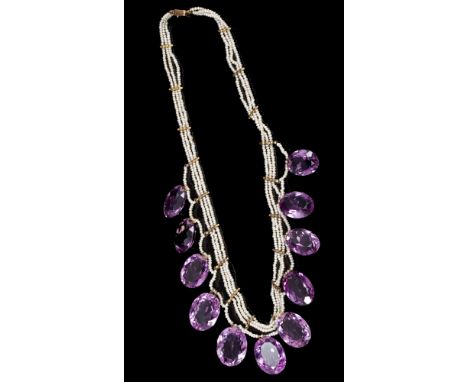 Victorian amethyst and seed pearl necklace with eleven graduated oval cut amethysts suspended from seed pearl swags, the trip