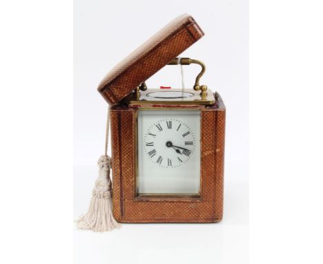 Early 20th century brass carriage clock with white enamel dial, brass case with bevelled glass panels, on bracket feet, 14cm 