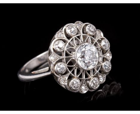 Early 20th century Belle Époque diamond cocktail ring, the openwork circular cluster set with old cut diamonds, in millegrain