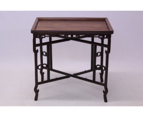 Antique Chinese hardwood tray on stand, the rectangular tray with geometric scroll and ball frieze, 71cm x 47cm, on conformin