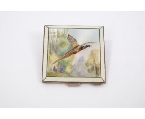 Late 1940s silver and enamel powder compact with enamelled panel of cock pheasant in flight, with cream guilloche enamel bord