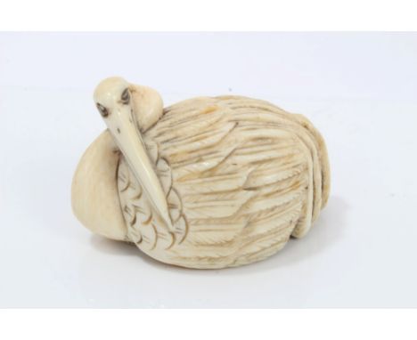 Late 19th century Japanese netsuke of a heron pruning its feathers, signed, 4.5cm