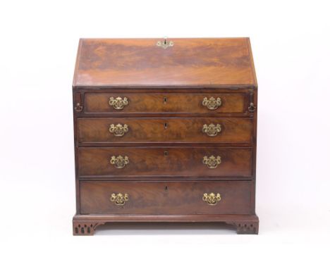 George III flame mahogany bureau - the fall enclosing fitted interior about blind fret cupboard, with graduated drawers below