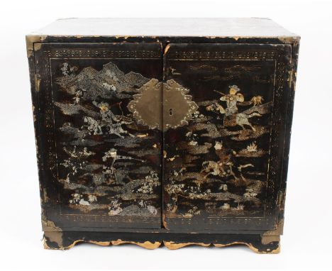 18th century European Chinese-style chinoiserie black and gilt and mother of pearl inlaid table cabinet, the doors decorated 