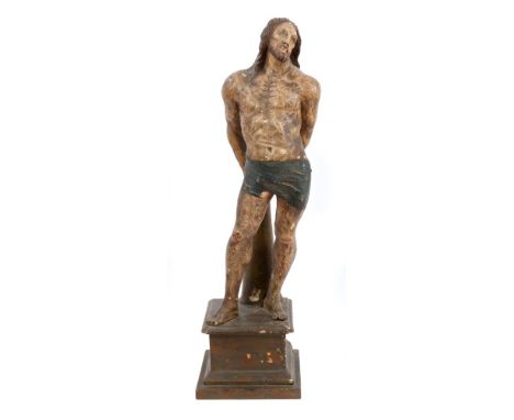 Unusual antique North Italian carved and polychrome painted figure of Christ at the post, the chained figure raised on square