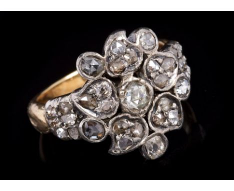 19th century diamond cluster ring - possibly Anglo-Indian, the stylised flower-head design with rose cut diamonds in silver s