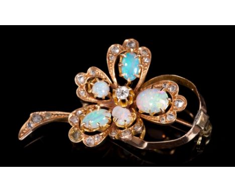 Edwardian opal and diamond brooch, the stylised floral spray set with five opal cabochons and old cut and rose cut diamonds