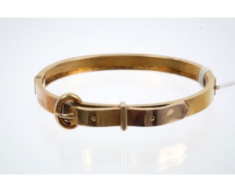 Victorian yellow metal hinged bangle in the form of a belt CONDITION REPORT Good condition commensurate with age.  No hallmar