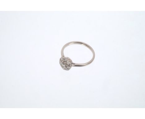Diamond cluster ring, the flower-head cluster comprising nine brilliant cut diamonds estimated to weigh approximately 0.50 ca