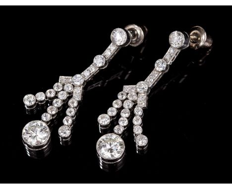 Pair Art Deco-style diamond pendant earrings, each designed as a tassel with a principal brilliant cut diamond estimated to w