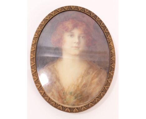 Circa 1920s portrait miniature on ivory of a young woman, oval, 9.5cm x 8cm, in gilt glazed frame CONDITION REPORT No cracks-