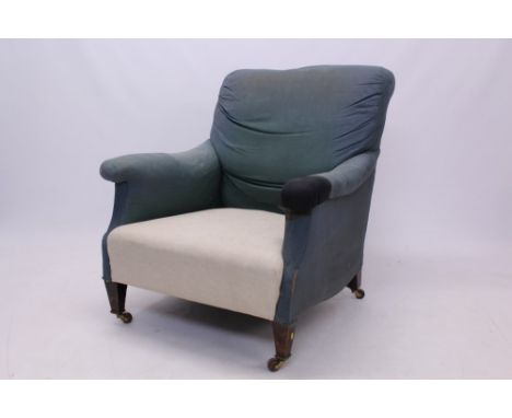 Early 20th century Howard-style deep armchair raised on square tapered legs and ceramic castors