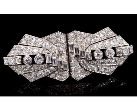 Fine Art Deco French diamond double clip brooch, the openwork plaque designed as a stylised geometric bow with an asymmetric 