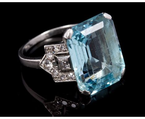 Art Deco aquamarine and diamond set cocktail ring, the central step cut aquamarine estimated to weigh approximately 8.84 cara