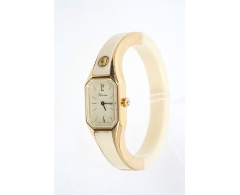 Ladies' Hermes bangle wristwatch in gilt and white ivorine case, with manual-wind movement