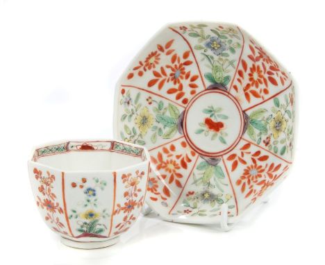 A Chelsea small octagonal tea bowl and saucer, unusually painted in the Chinese famille verte palette, with radiating panels 