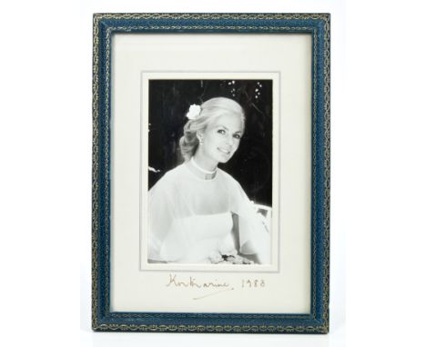 HRH Katharine, Duchess of Kent - signed presentation portrait photograph of The Duchess with a flower in her hair, signed in 