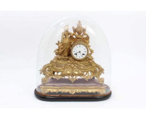 Ornate late 19th century French gilt metal mantel clock with white enamel dial, cylinder movement, mounted with lady with rid