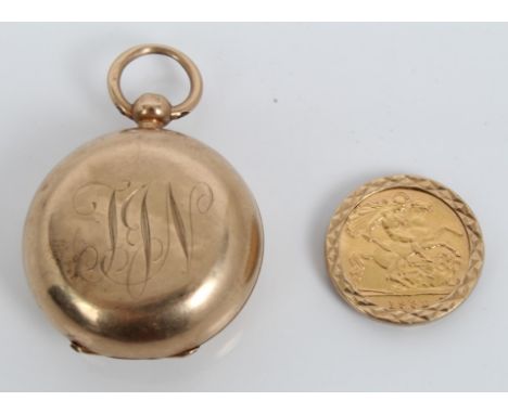 Gold (9ct) sovereign holder and a gold half sovereign in mount CONDITION REPORT Total gross weight approximately 19.8 grams. 
