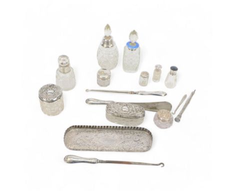 Group of silver, comprising pin tray with embossed floral decoration, silver matchbox cover, silver handled shoe horn and but
