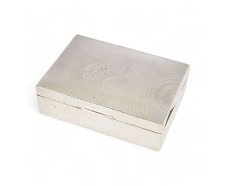 1920s silver mounted playing card box, of rectangular form, the hinged cover with engine turned decoration and inscribed brid