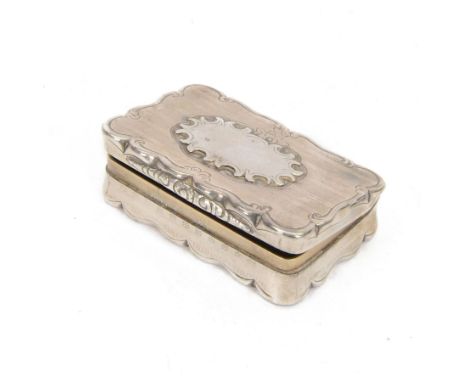 Victorian silver snuff box, of rectangular form with shaped rim, engine turned decoration, and later applied blank cartouche,