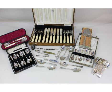 A cased pair of silver plated spoons with engraved bowls and gilt metal crown terminals, a cased set of six pairs of fish kni