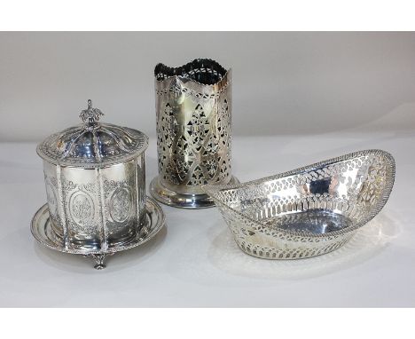 A silver plated biscuit barrel of cylindrical shape with domed lid and cast scroll finial, 18cm, a pierced oval dish, 28cm, a