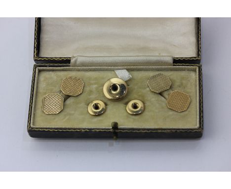 A pair of 9ct gold engine turned cufflinks  