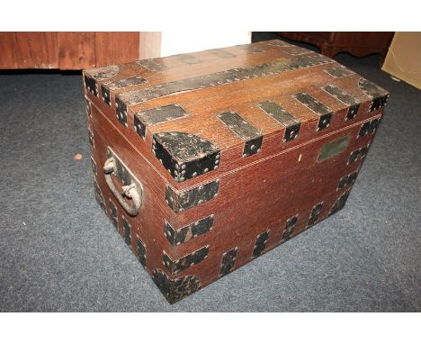 A metal bound oak silver chest with side handles and vacant brass plaque, with green baize lined interior and pull-out shelf,