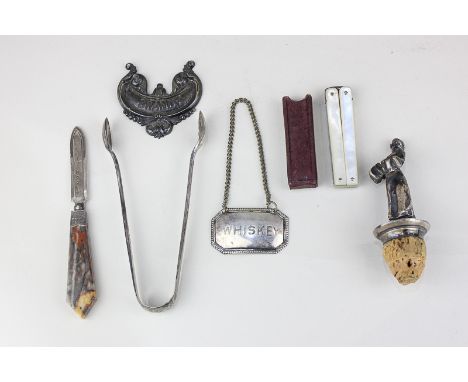 A Victorian silver page marker with agate handle, hallmarked Birmingham 1897, a pair of silver sugar tongs, a pair of folding