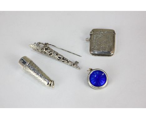 An Edward VII silver vesta case and a small tapered box with ring handle, Birmingham 1902, both with engraved scroll decorati