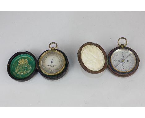 A Negretti & Zambra pocket barometer in original fitted leather case, together with a 19th century pocket compass inscribed H