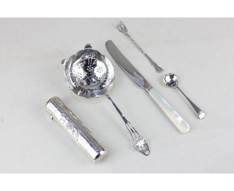 A Victorian silver scent bottle, tubular foliate engraved, Chester 1882; a silver tea strainer, a butter knife, fork and spoo