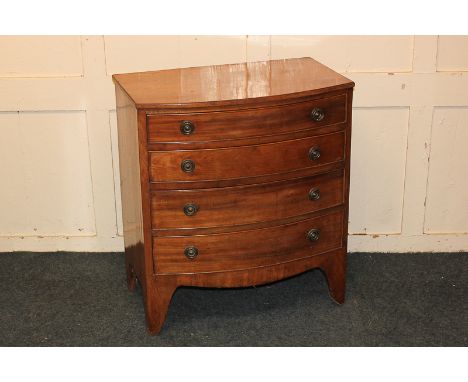 A small mahogany bowfront chest of four graduated drawers, on bracket feet, 61cm (probably converted from a commode)