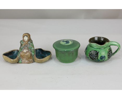 A Brannum Barum green glazed pottery cream jug, green circular pot with tubeline William Moorcroft signed lid, and an Art Nou