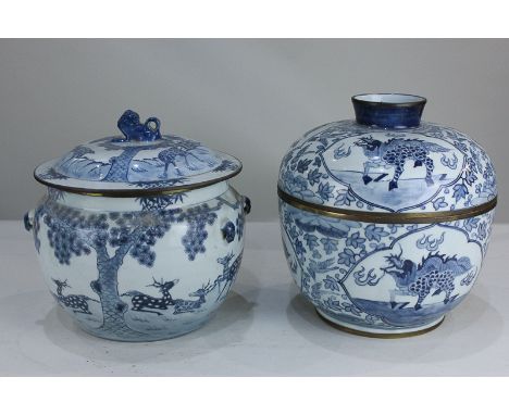 A Chinese porcelain blue and white jar and cover depicting deer in a landscape, the lid with Fo dog finial, 24cm, together wi