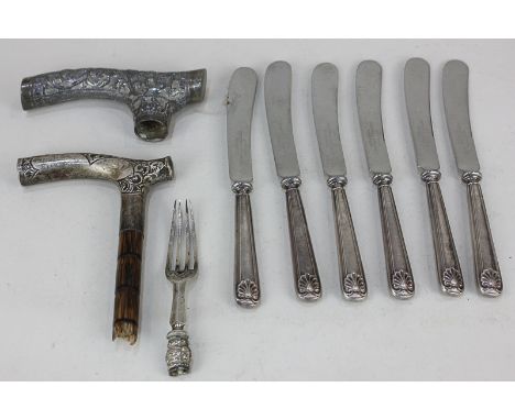 A set of six George V silver handled dessert knives, maker John Biggin, Sheffield, 1926, together with a silver walking cane 