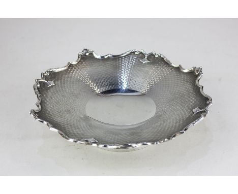 A George V silver pedestal dish with engine turned decoration and scroll border, on circular base, maker Walker & Hall, Sheff