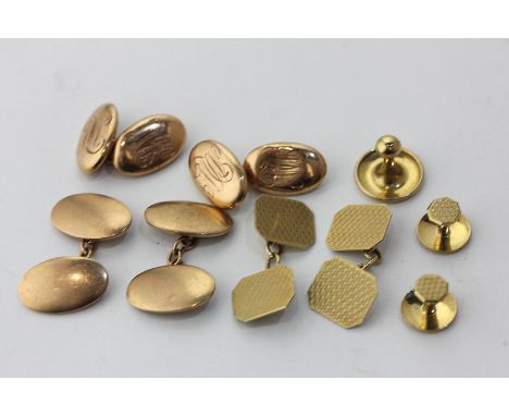 A cased pair of 9ct gold cufflinks, engine turned with a pair of studs and another; a pair of 9ct gold 'torpedo' cufflinks, a