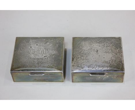 A pair of Elizabeth II silver cigarette boxes, maker Garrard & Co Ltd, London, 1962, monogrammed