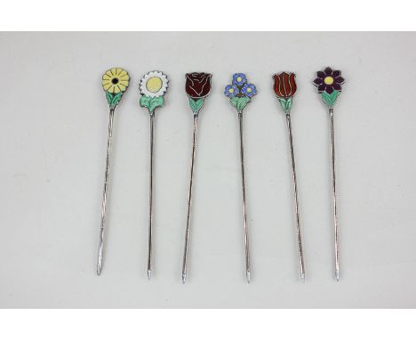 A set of six Danish silver cocktail sticks by Meka, each with enamel flower finial, marked Meka Sterling Denmark, each 7.7cm 