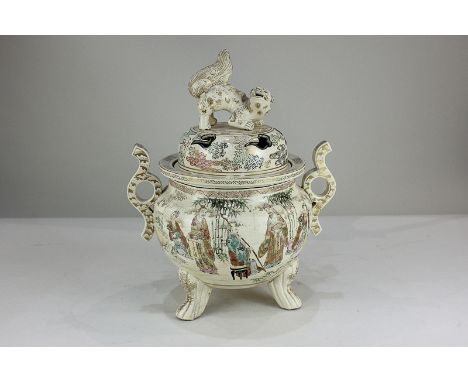 A Japanese Satsuma pottery koro depicting figures in a landscape with bamboo, the lid with Fo dog finial (a/f), 33cm high