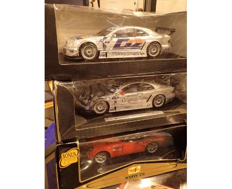 Three diecast car models one Maisto BMW28 and two Mercedes Benz